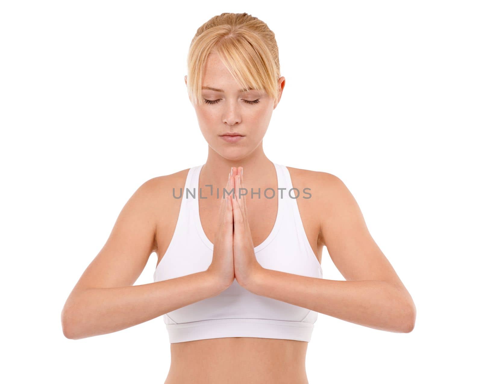 She meditates before and after every workout. an attractive young woman practicing meditation