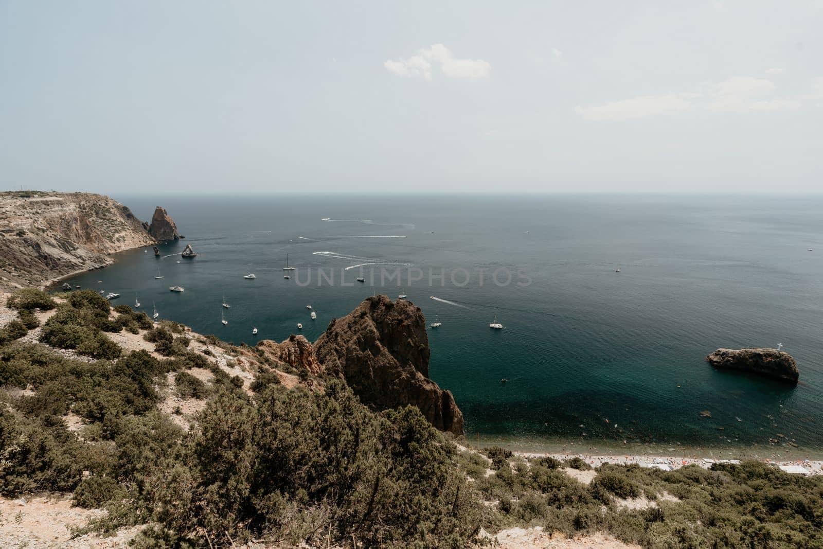 Aerial panoramic view of beautiful sunset above sea. Beautiful seascape. Sun glare, small waves on the water surface. Evening. Horizon. Nobody. No people. Copy space. Never-ending beauty of nature