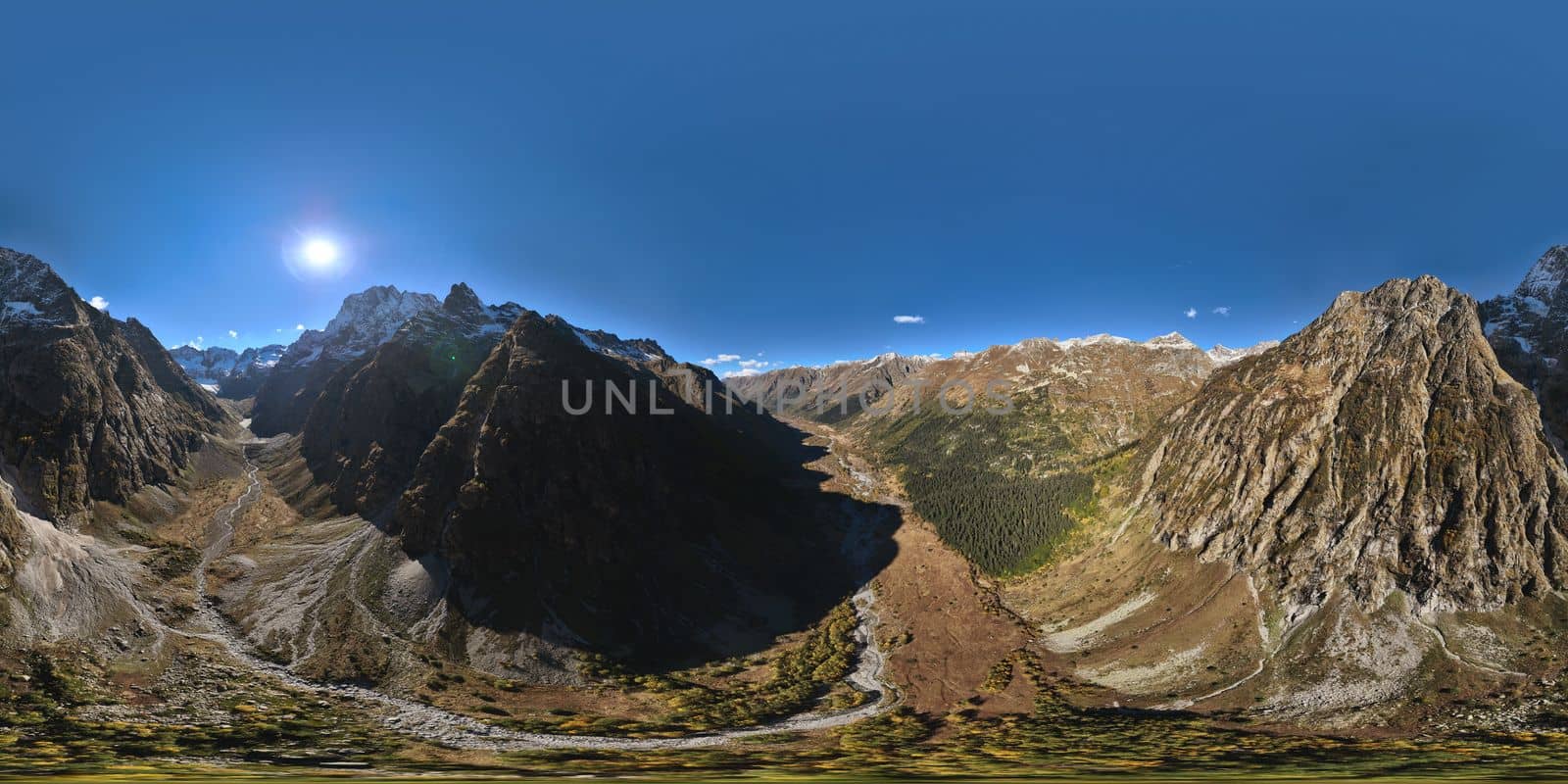 panoramic shot of a mountain range in summer on a sunny cloudless day. bare rocky cliffs by yanik88