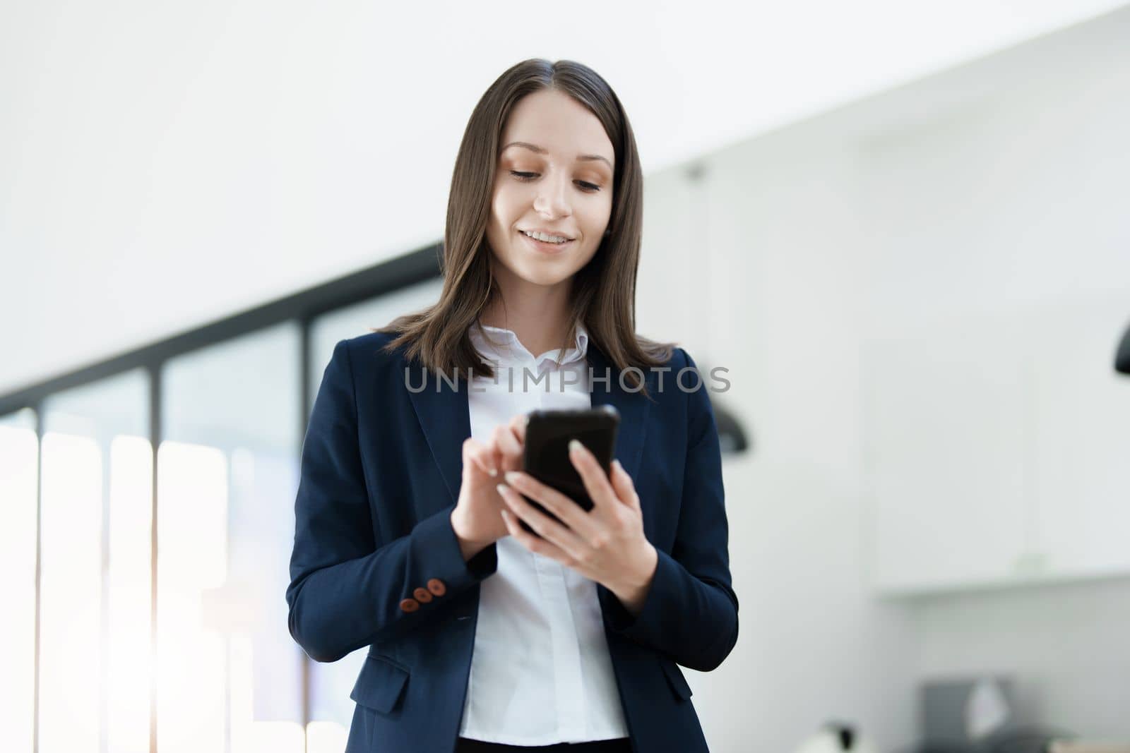 business owner or Asian female marketers are using business phones in office work.