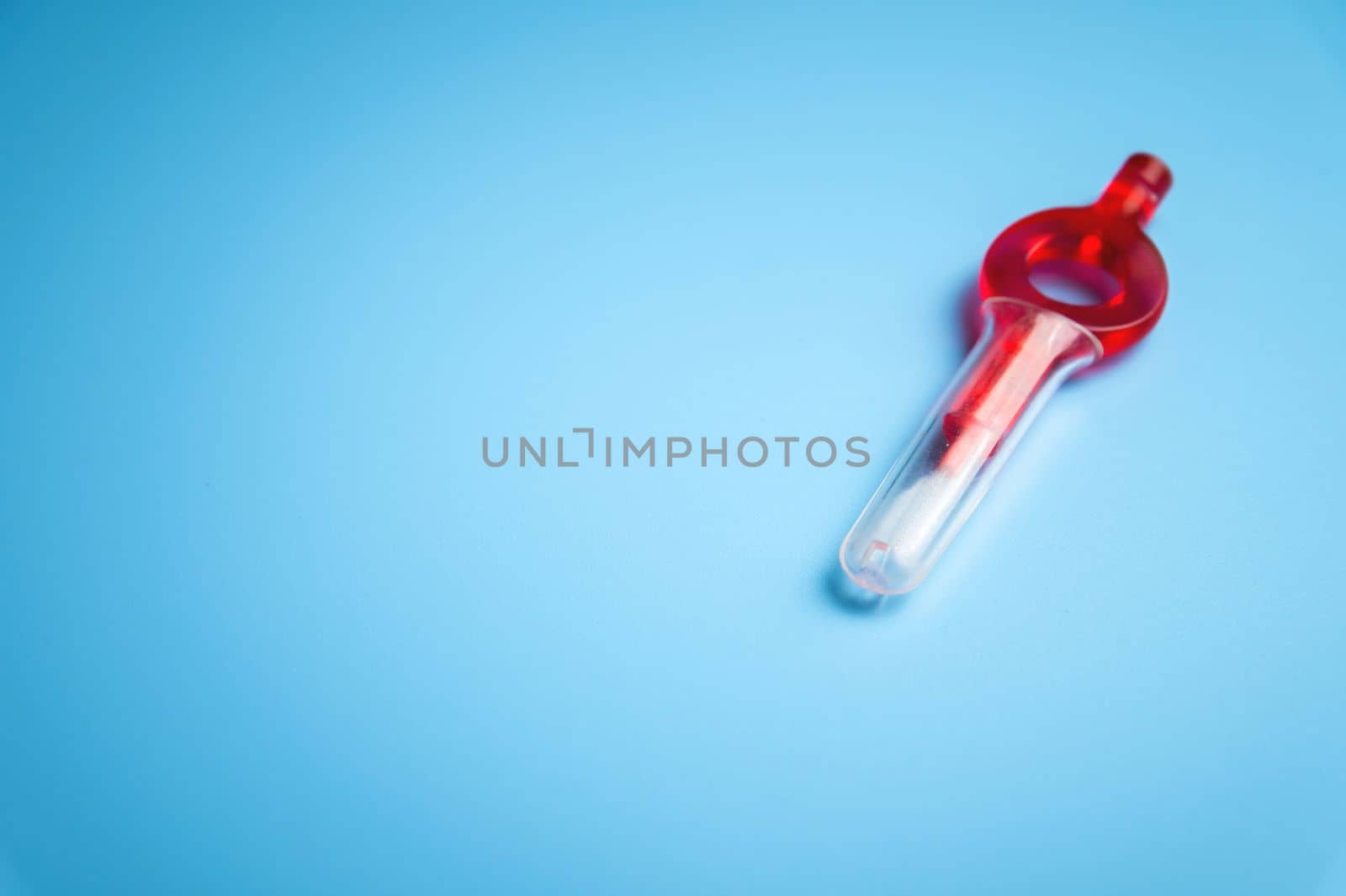 red interdental orthodontic new toothbrush on blue background, banner mockup by yanik88
