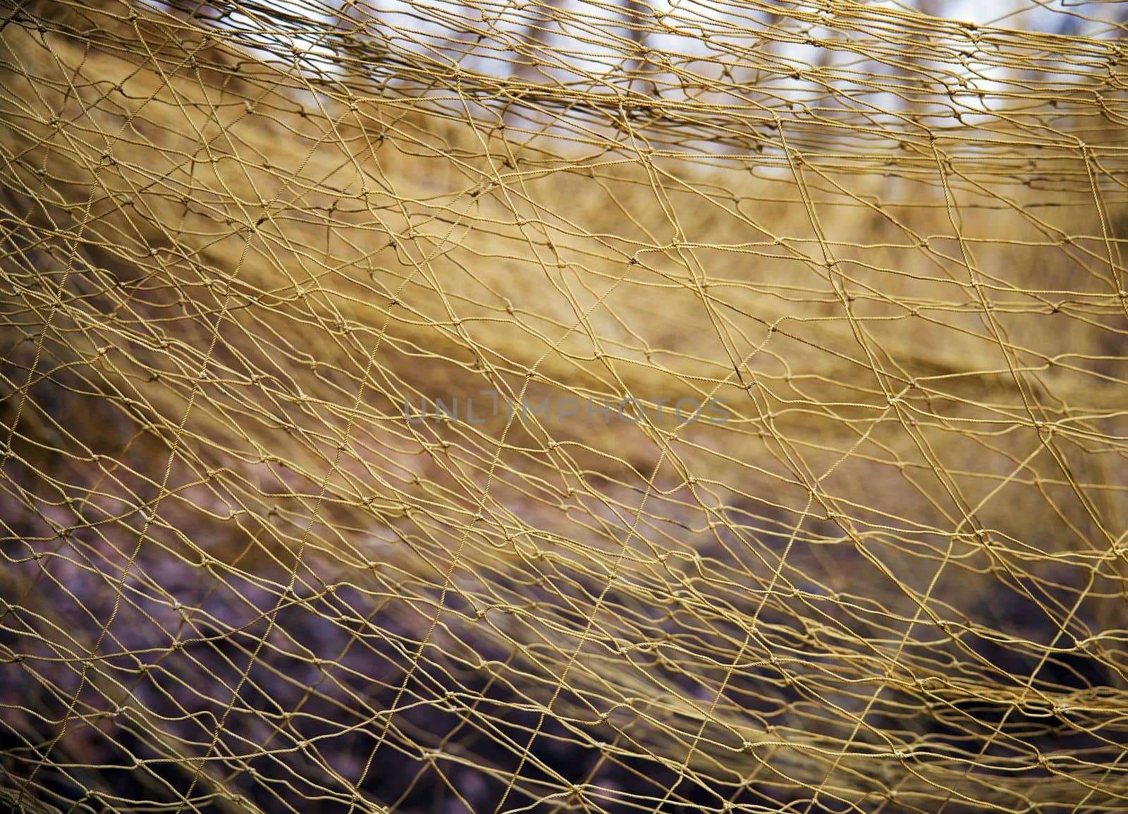 Large mesh net for catching animals. Rescue and relocation of animals. Background from the net. Nets for catching wild animals in the forest. Trapping game animals. Unraveling trapping nets.