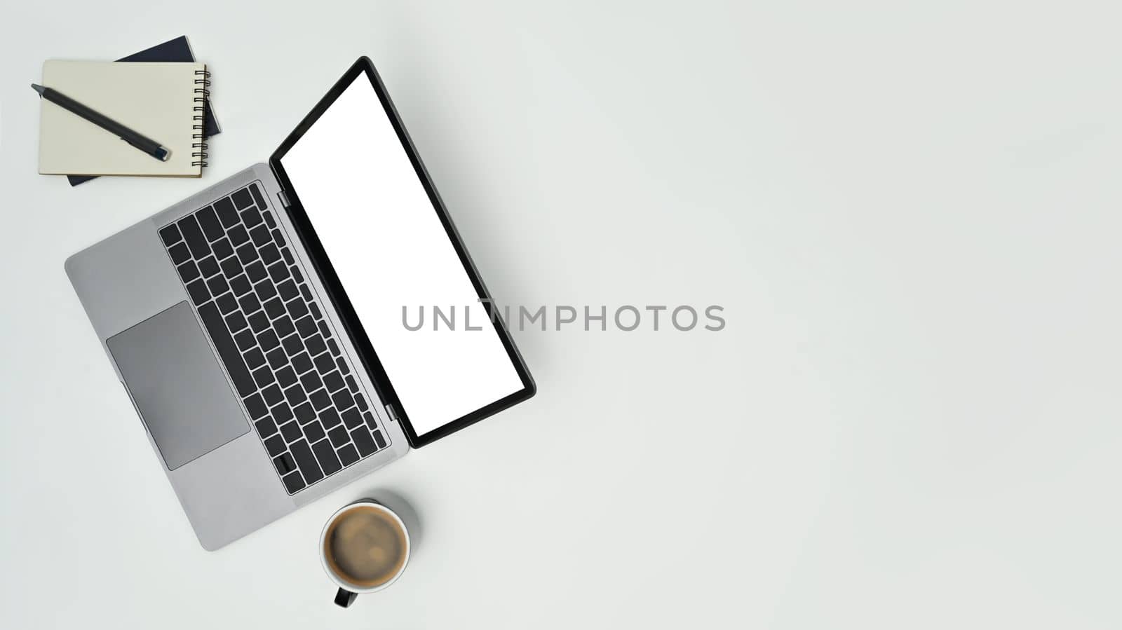 Mock up laptop computer, notepad and coffee cup on white background. Copy space for text information or content by prathanchorruangsak