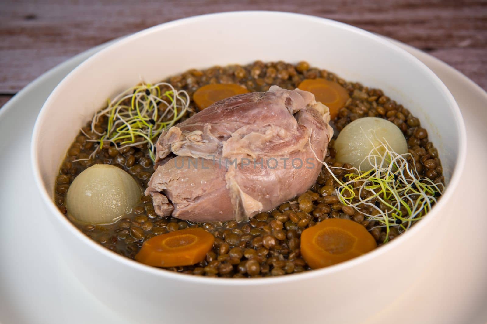 Recipe for salted pork shank with lentils. High quality photo