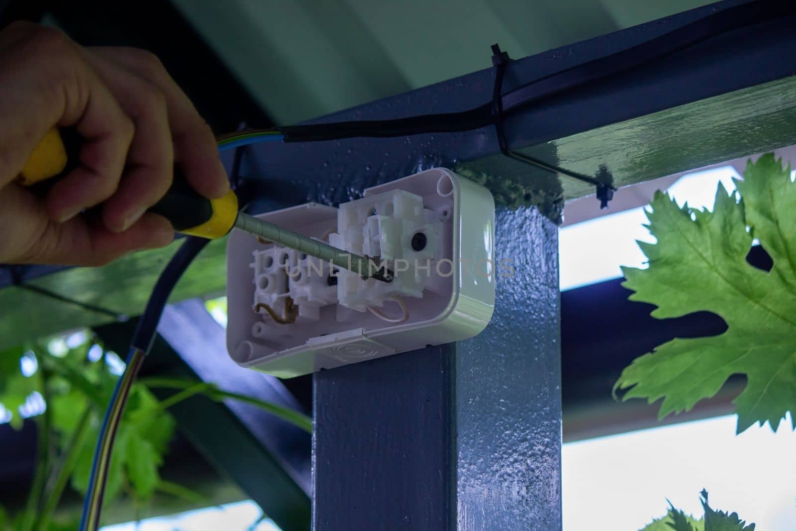 electrician to connect the outlet. selective focus