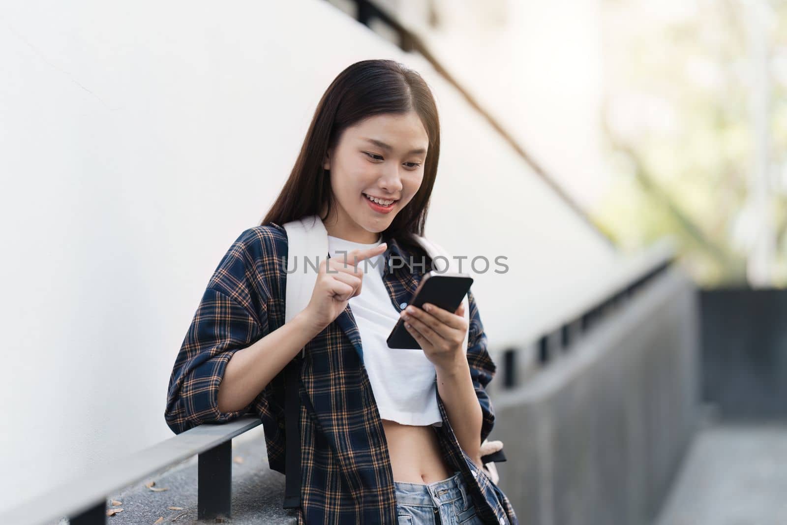 Portrait of beautiful student woman in university ready for learning. Education, scholarship and happy and proud female learner at university by itchaznong