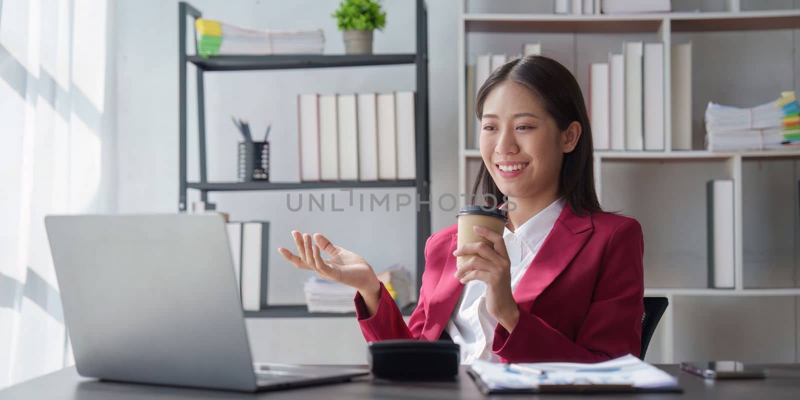 Asian Business woman working at home office and analyze financial report document. Accounting and Finance concept by itchaznong