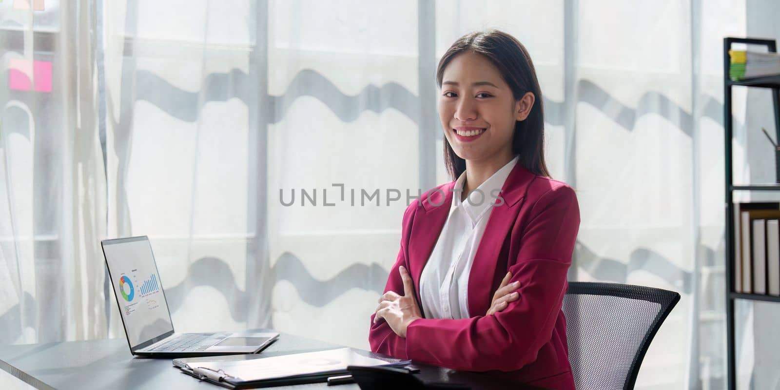 Asian Business woman working at home office and analyze financial report document. Accounting and Finance concept.