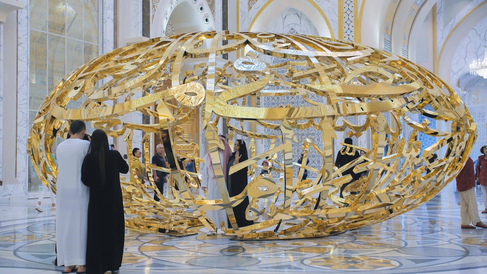 People walking near sculptural composition the power of words in Presidential Palace, Palace of Qasr al-Watan the Palace of the nation in Abu Dhabi