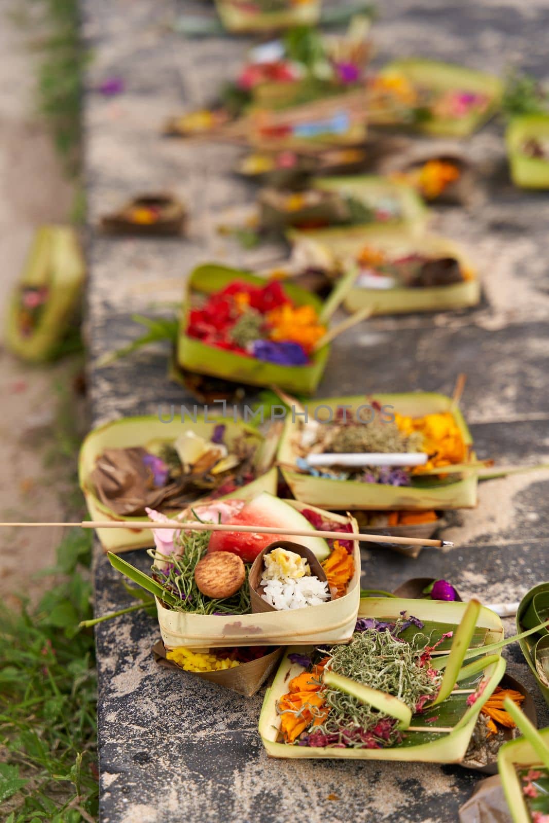 The layout on the ground of traditional offerings for the spirits on the island of Bali by Try_my_best