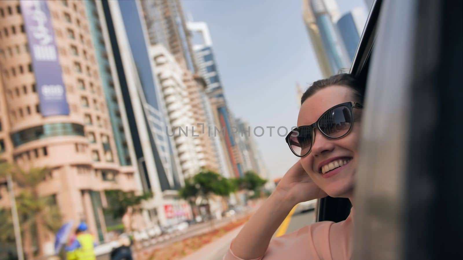 Happy Girl driving a car in Dubai