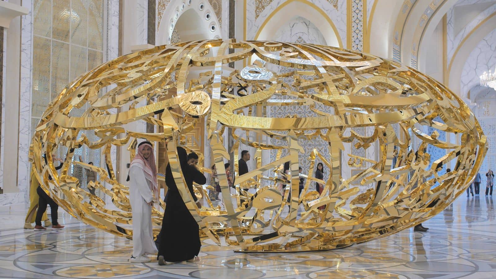 People walking near sculptural composition the power of words in Presidential Palace, Palace of Qasr al-Watan the Palace of the nation in Abu Dhabi