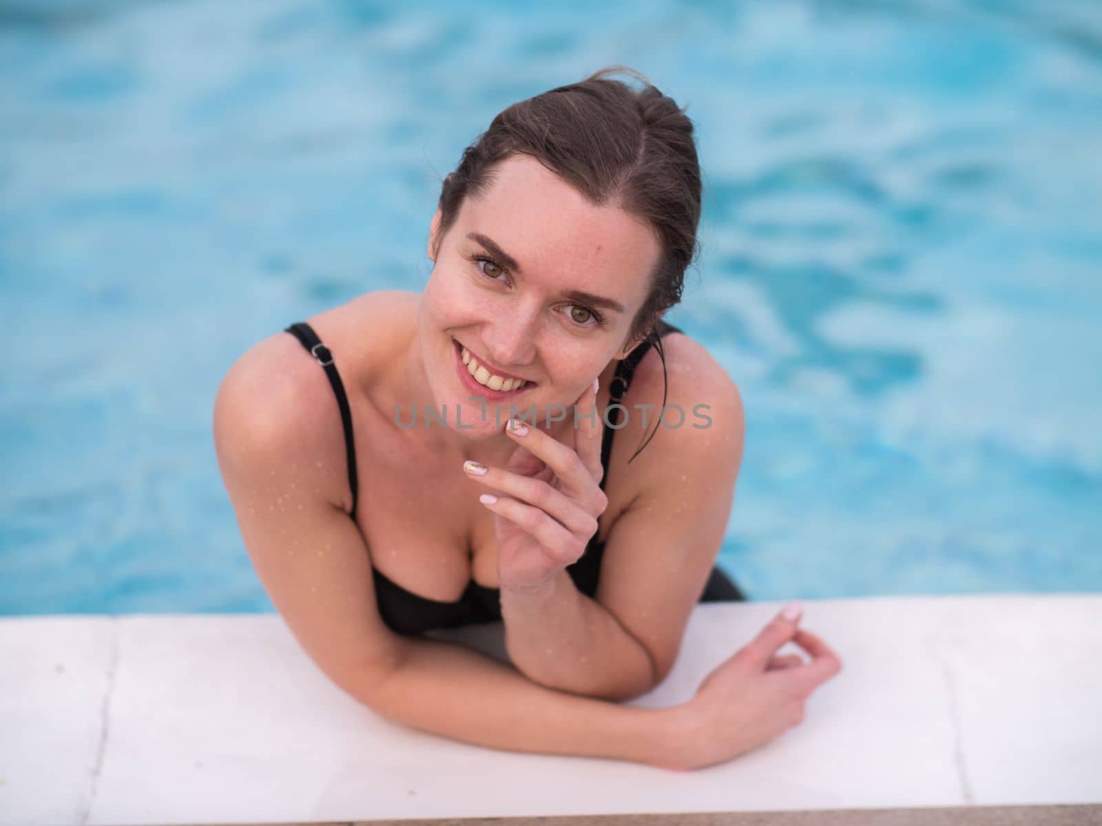 Young woman in the swimming pool.