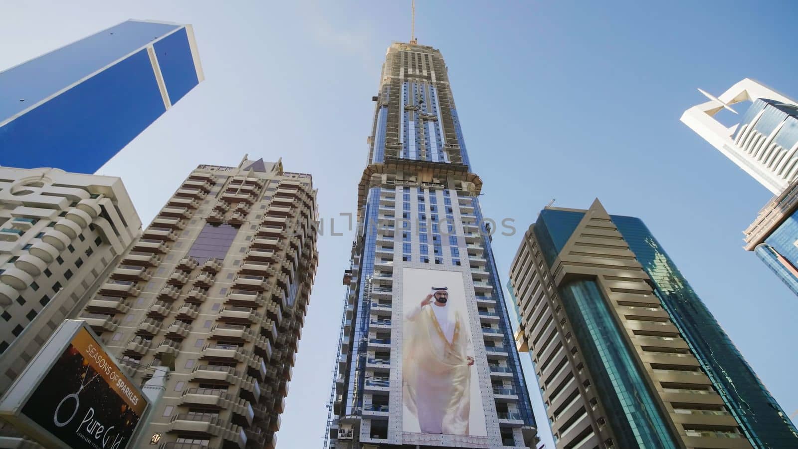Tall and modern skyscrapers of Dubai on a sunny day