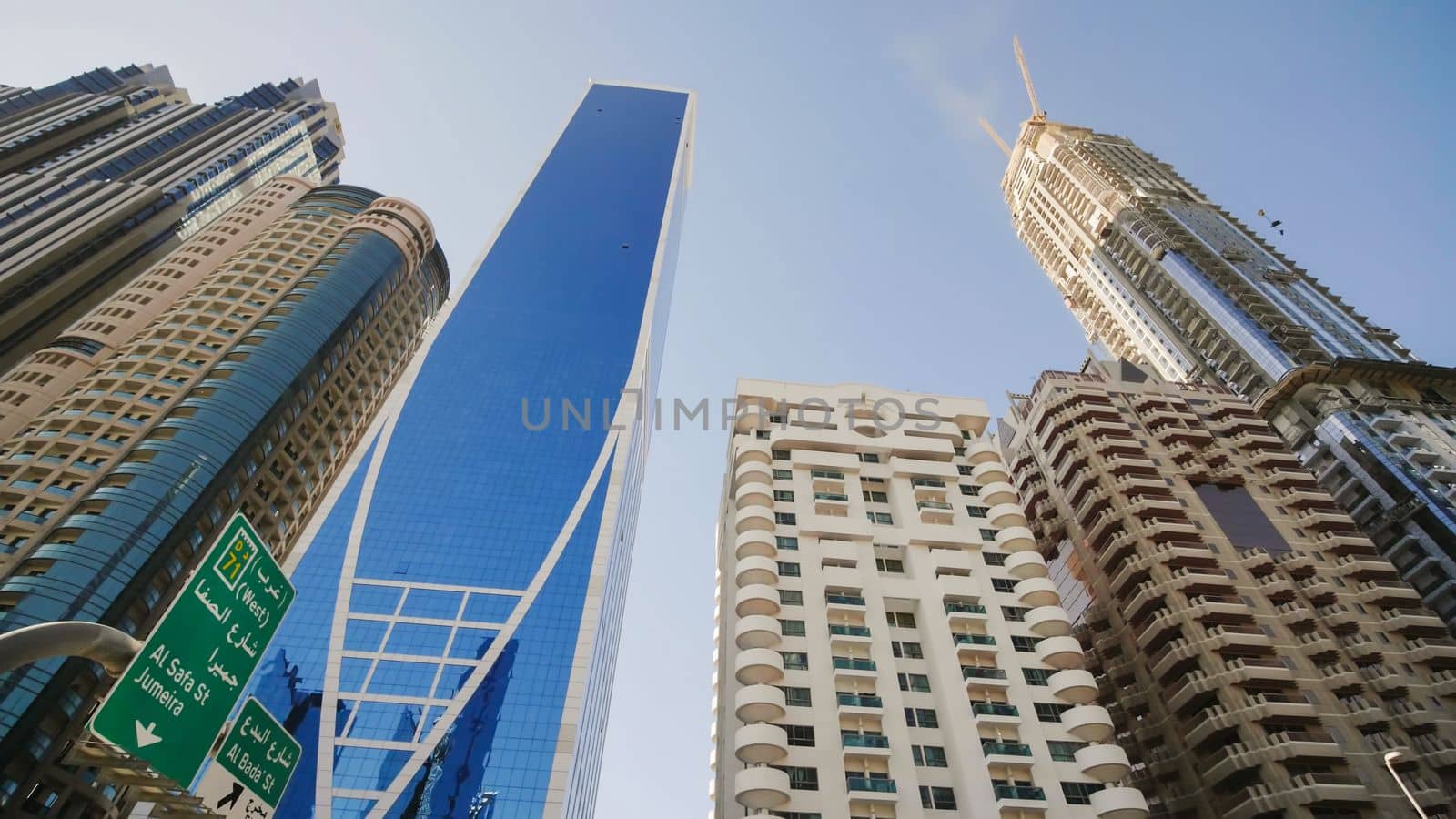 Tall and modern skyscrapers of Dubai on a sunny day