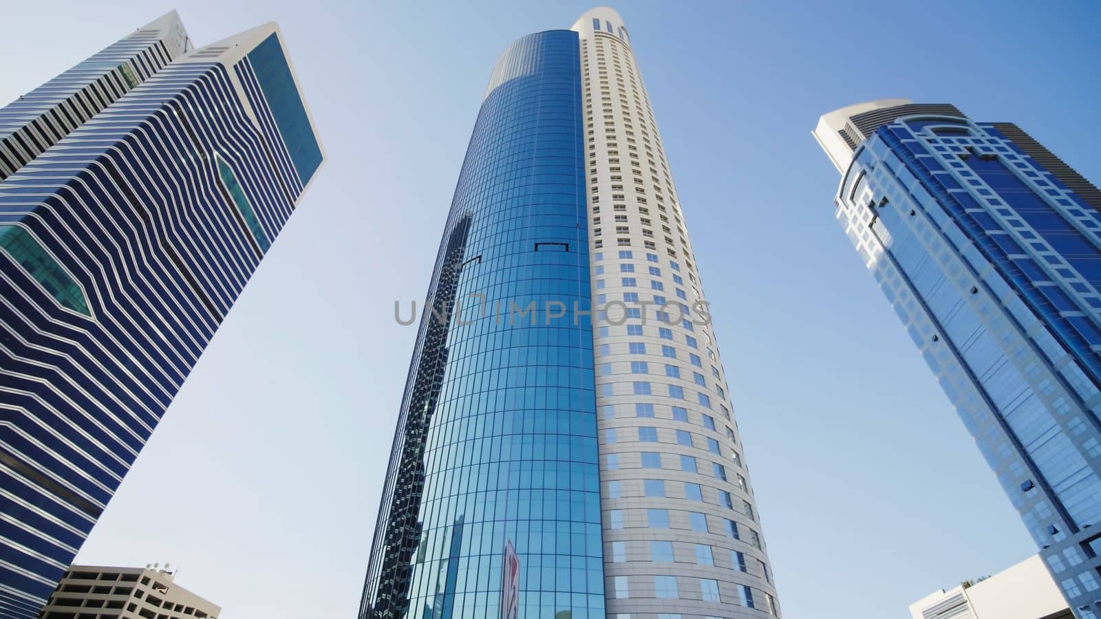 Tall and modern skyscrapers of Dubai on a sunny day