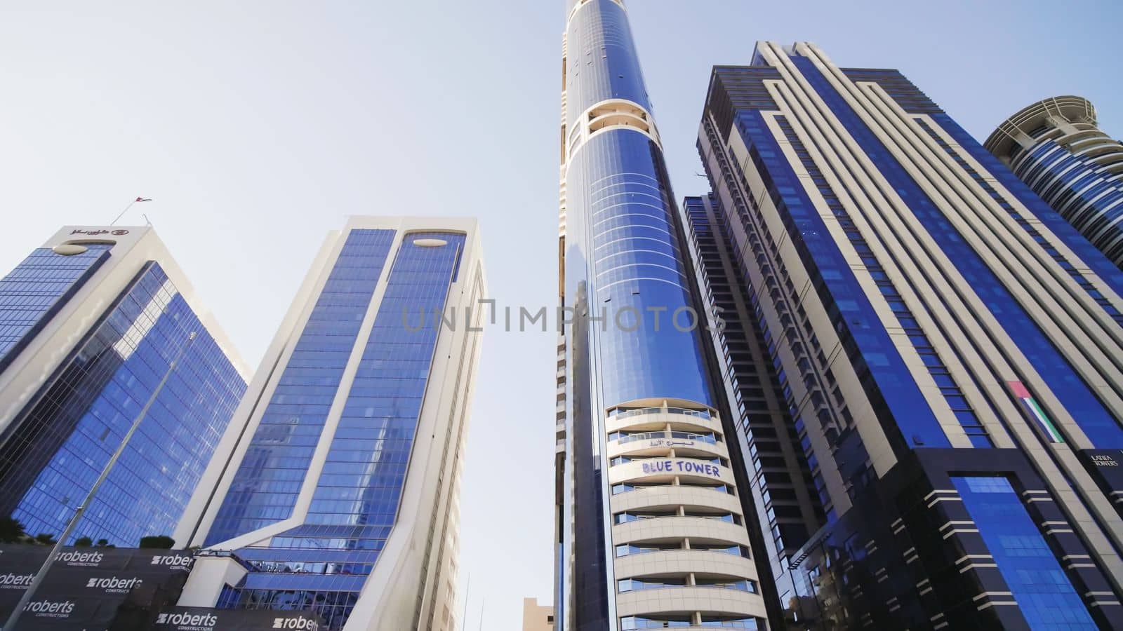 Tall and modern skyscrapers of Dubai on a sunny day