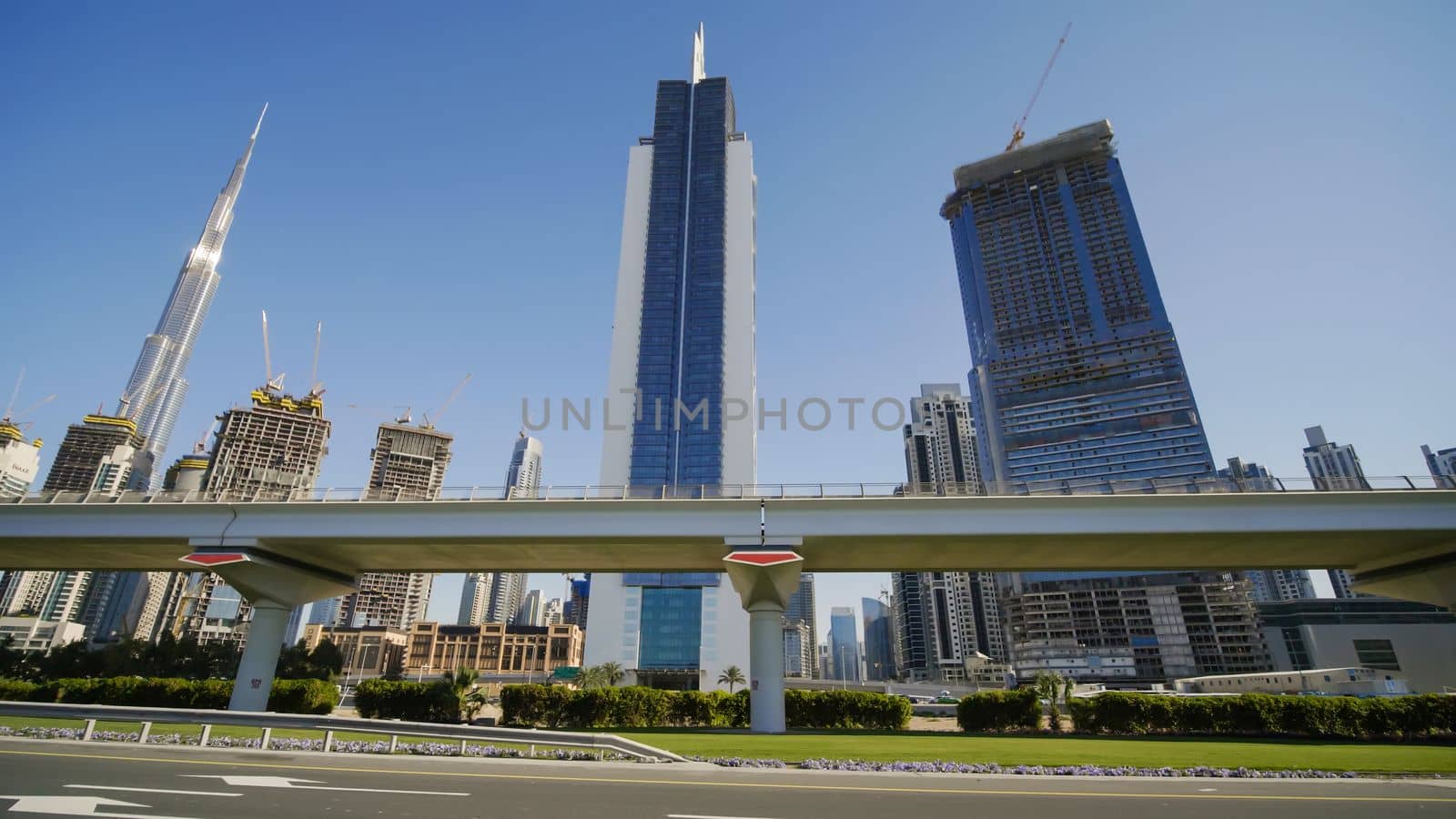 Tall and modern skyscrapers of Dubai on a sunny day
