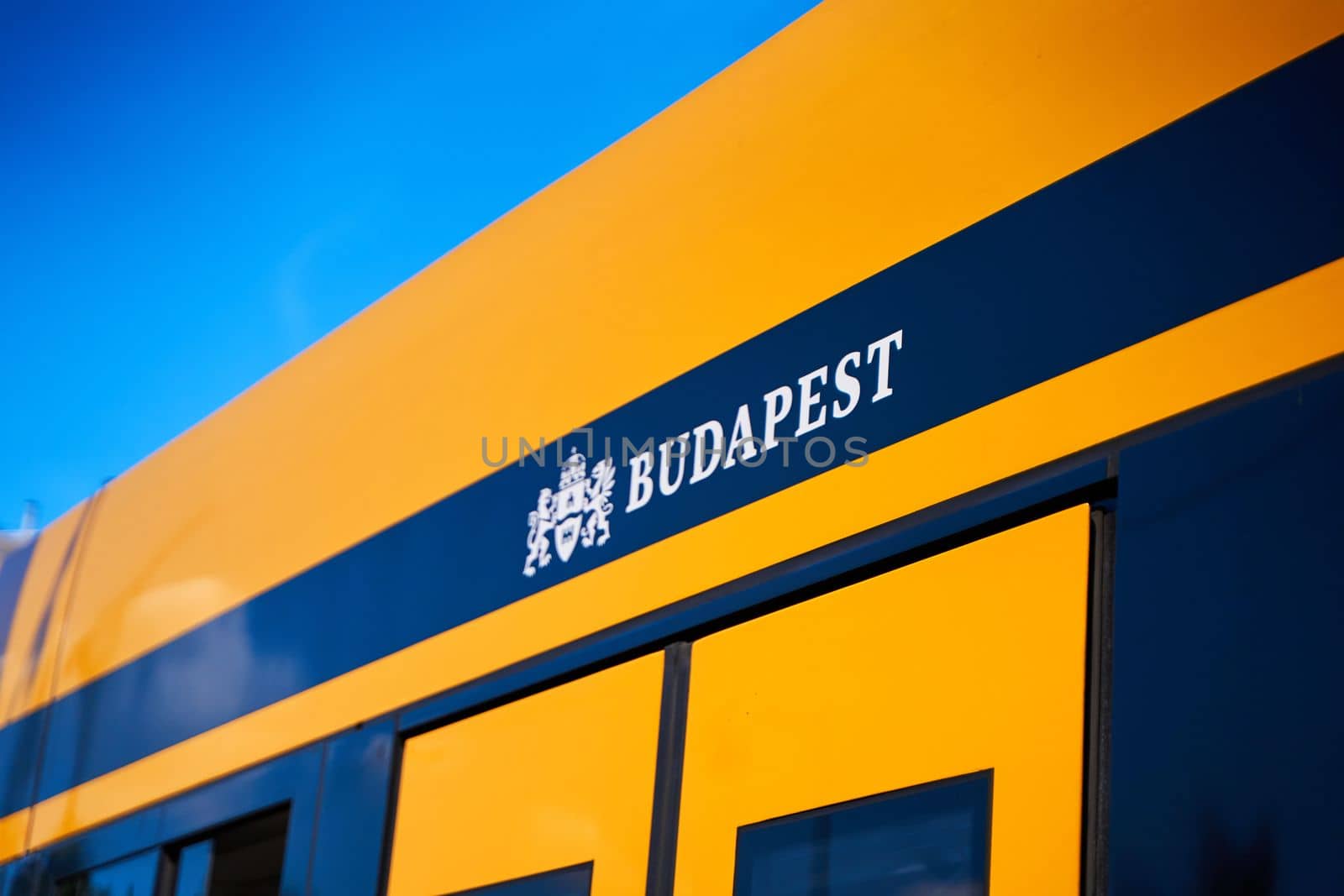 A sign with the name of the city of Budapest on a public tram.