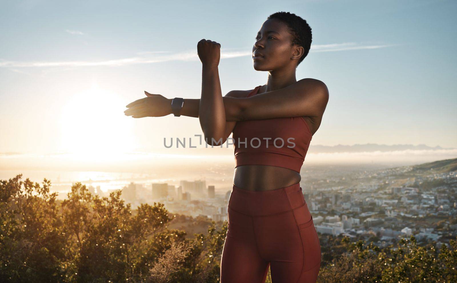 Fitness, hiking and black woman on mountain stretching, meditation and training in nature for healthy lifestyle. Health, wellness and workout for woman on cliff, yoga on hill for hike in mountains