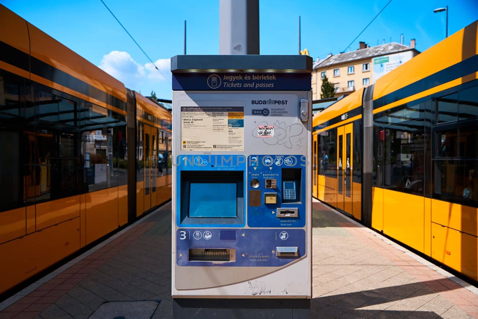A tram ticket machine installed at a tram stop. Budapest, Hungary - 08.25.2022