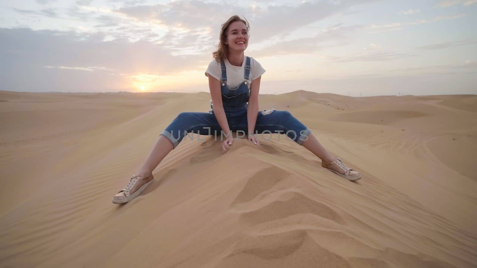 Happy girl in the desert of the arab emirates