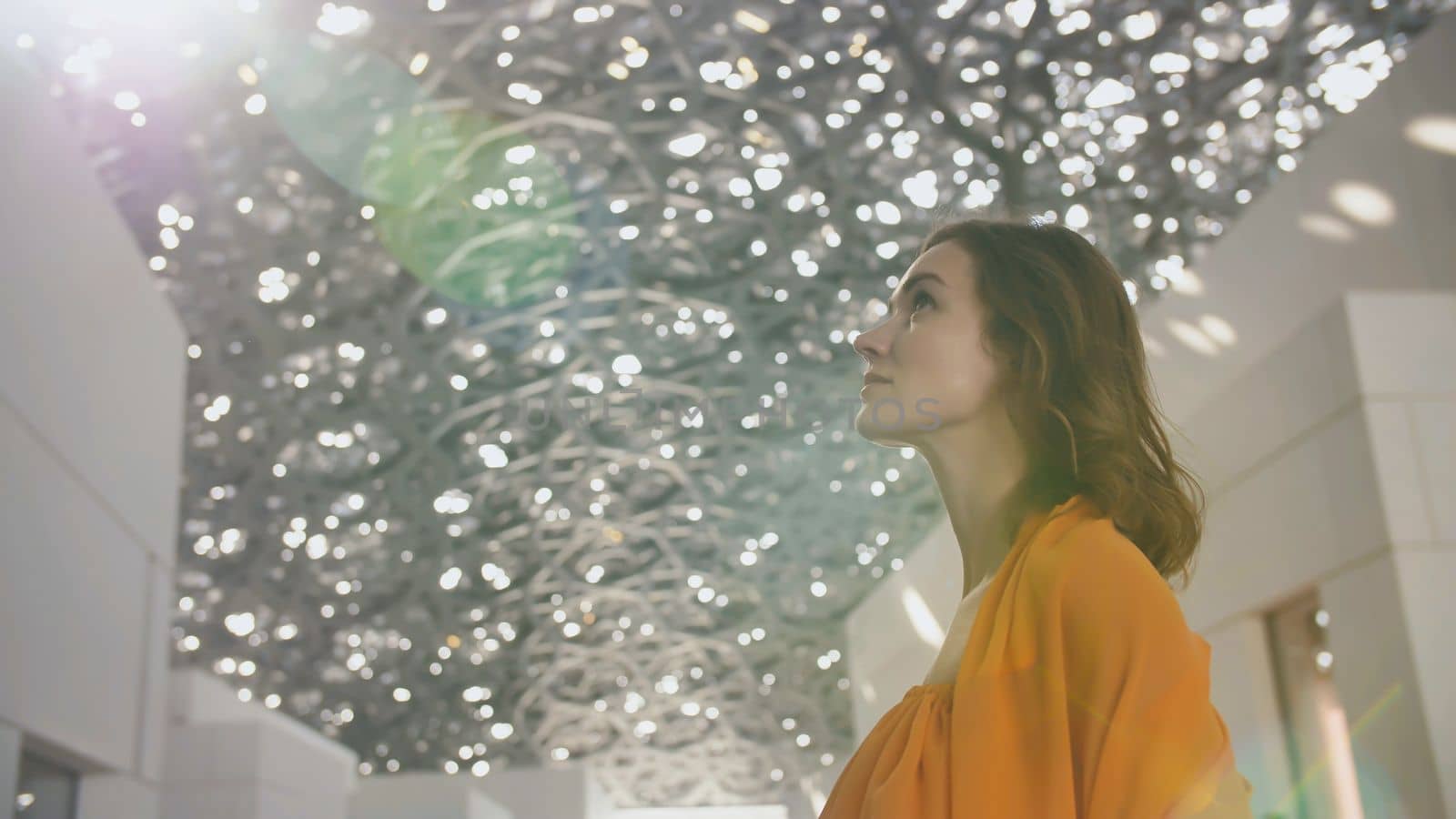 Girl enjoys views of the Louvre Hall in Abu Dhabi