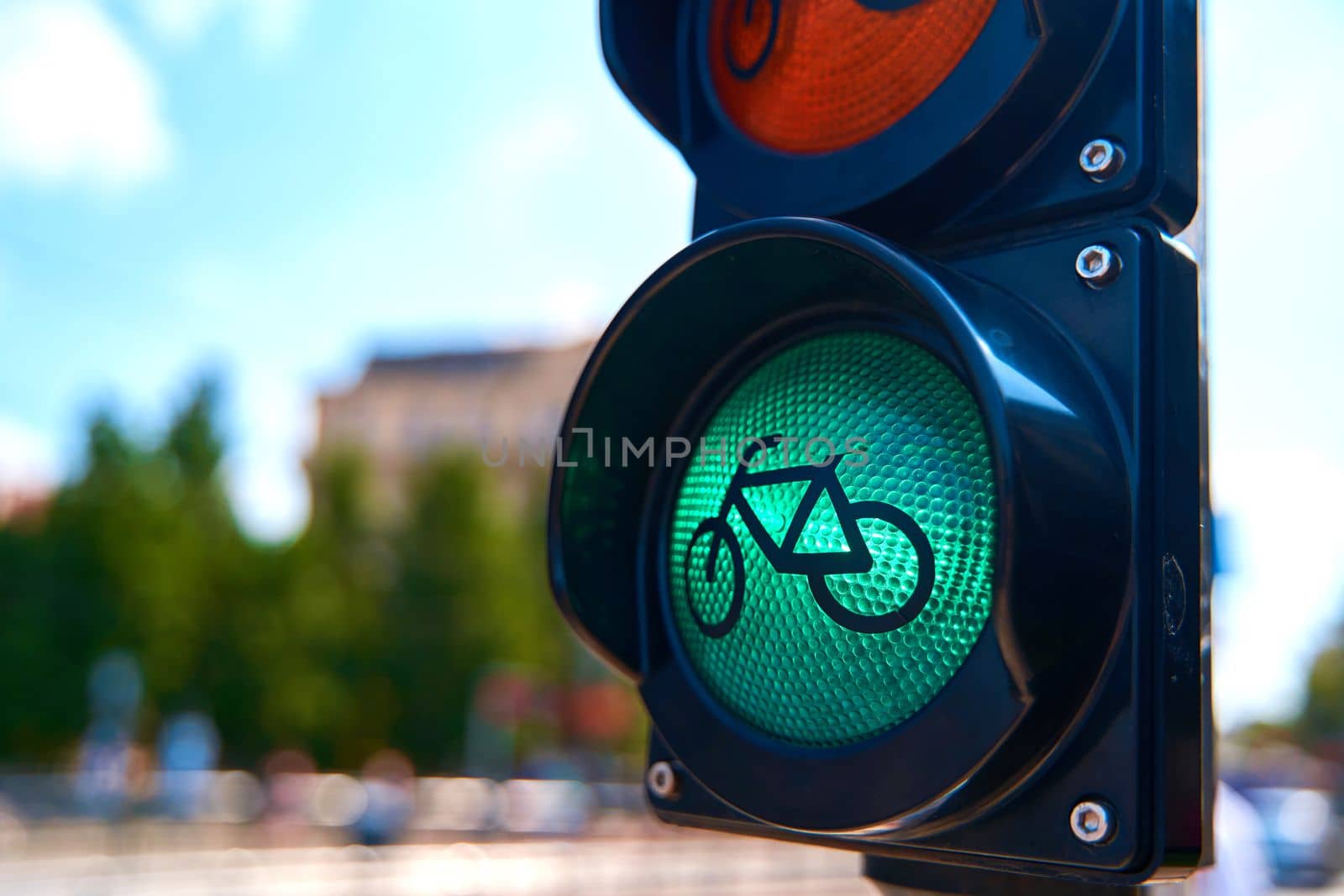 Close-up of a traffic light for cyclists, which is glowing green. A bicycle is shown on the traffic light by Try_my_best