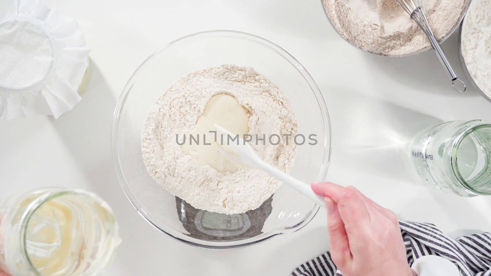 Flat lay. Measuring ingredients into a glass bowl to bake cinnamon rolls.