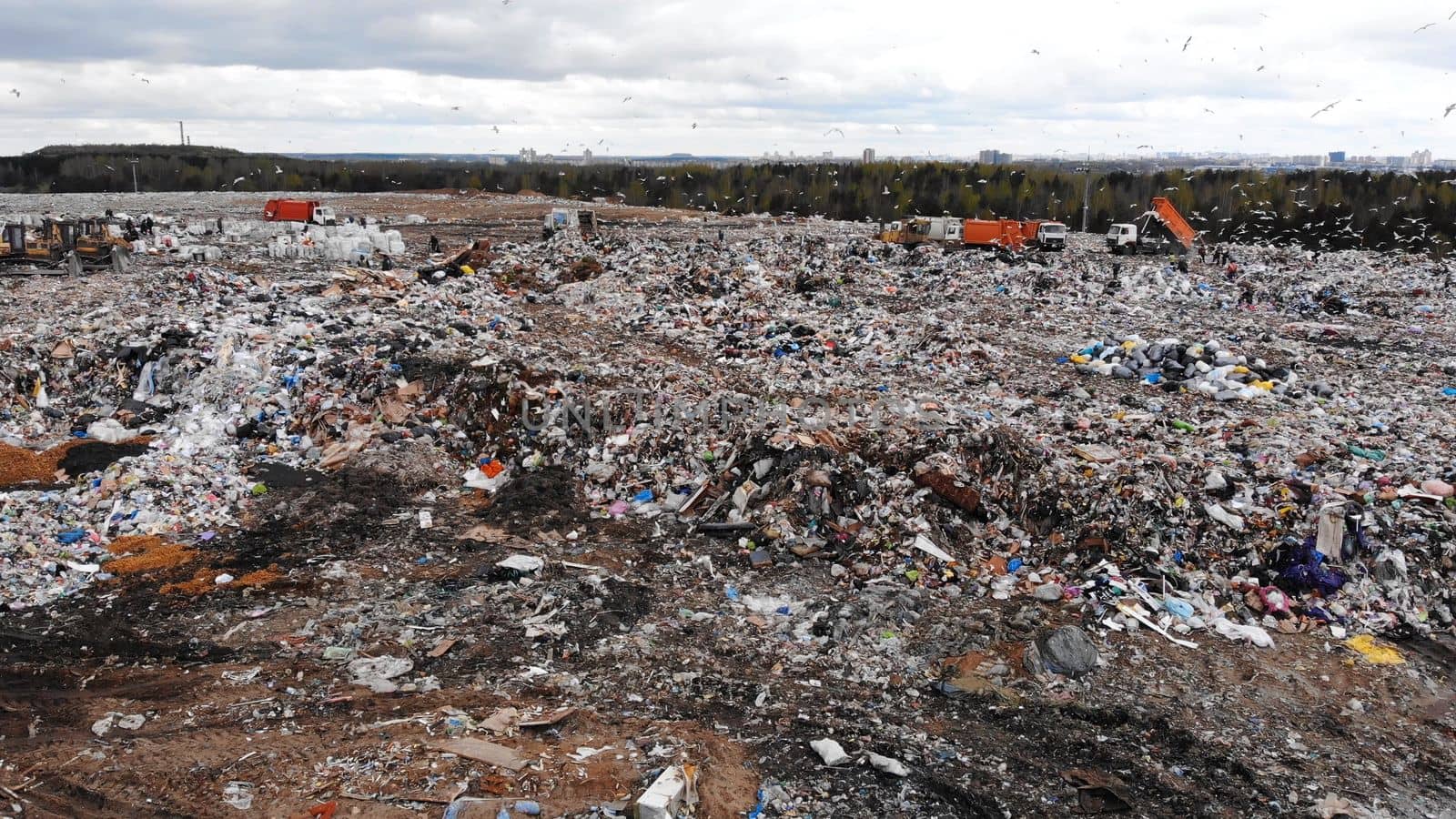 Large landfill near the metropolis in autumn