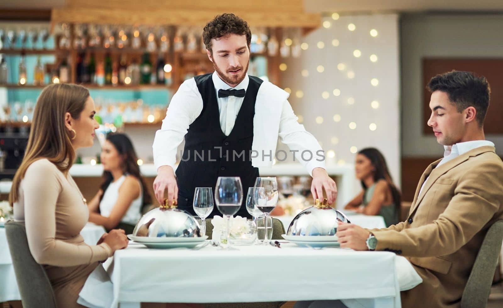 Restaurant, food and valentines day with a couple at a table in celebration of love, romance or marriage together. Wine, night or luxury fine dining with a man and woman celebrating their anniversary.
