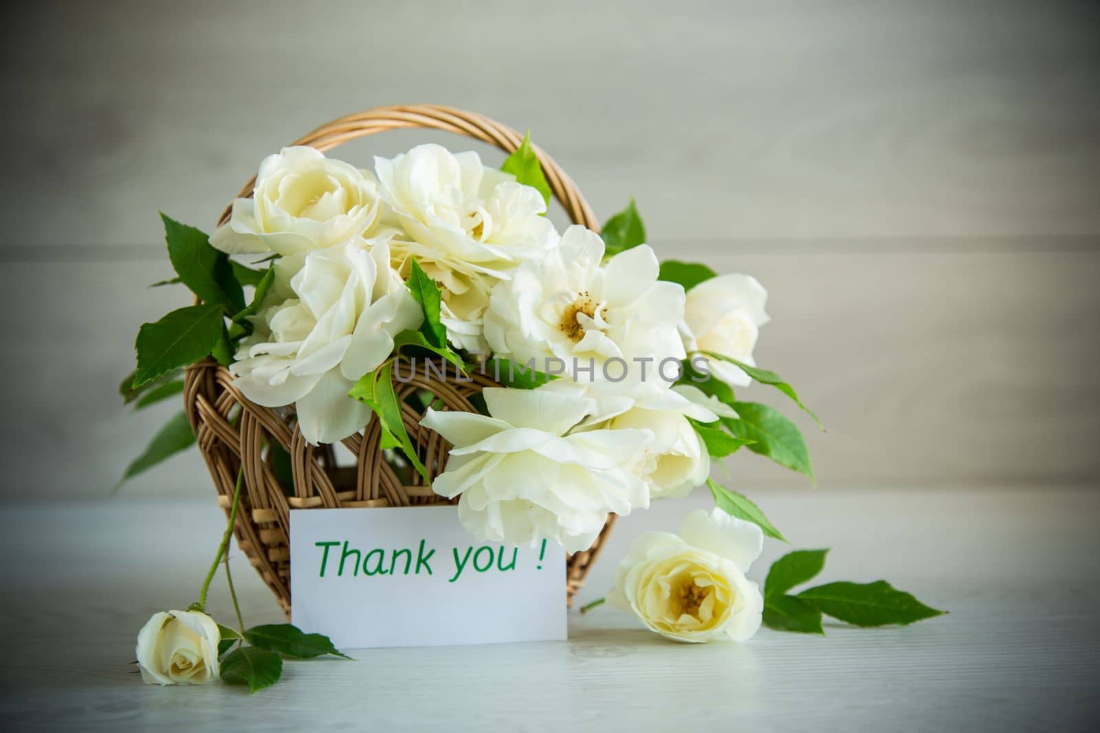 bouquet of beautiful white roses on a wooden table