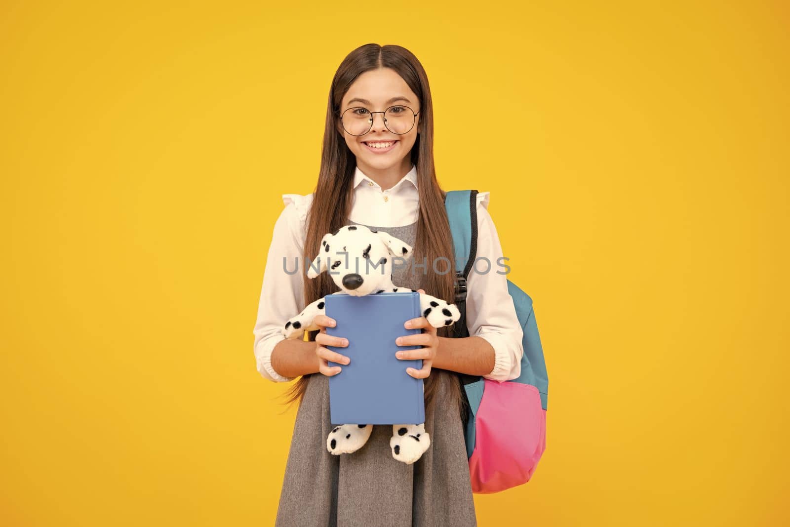 School teenager child girl with backpack hold toy. Fun study. Education and childhood concept