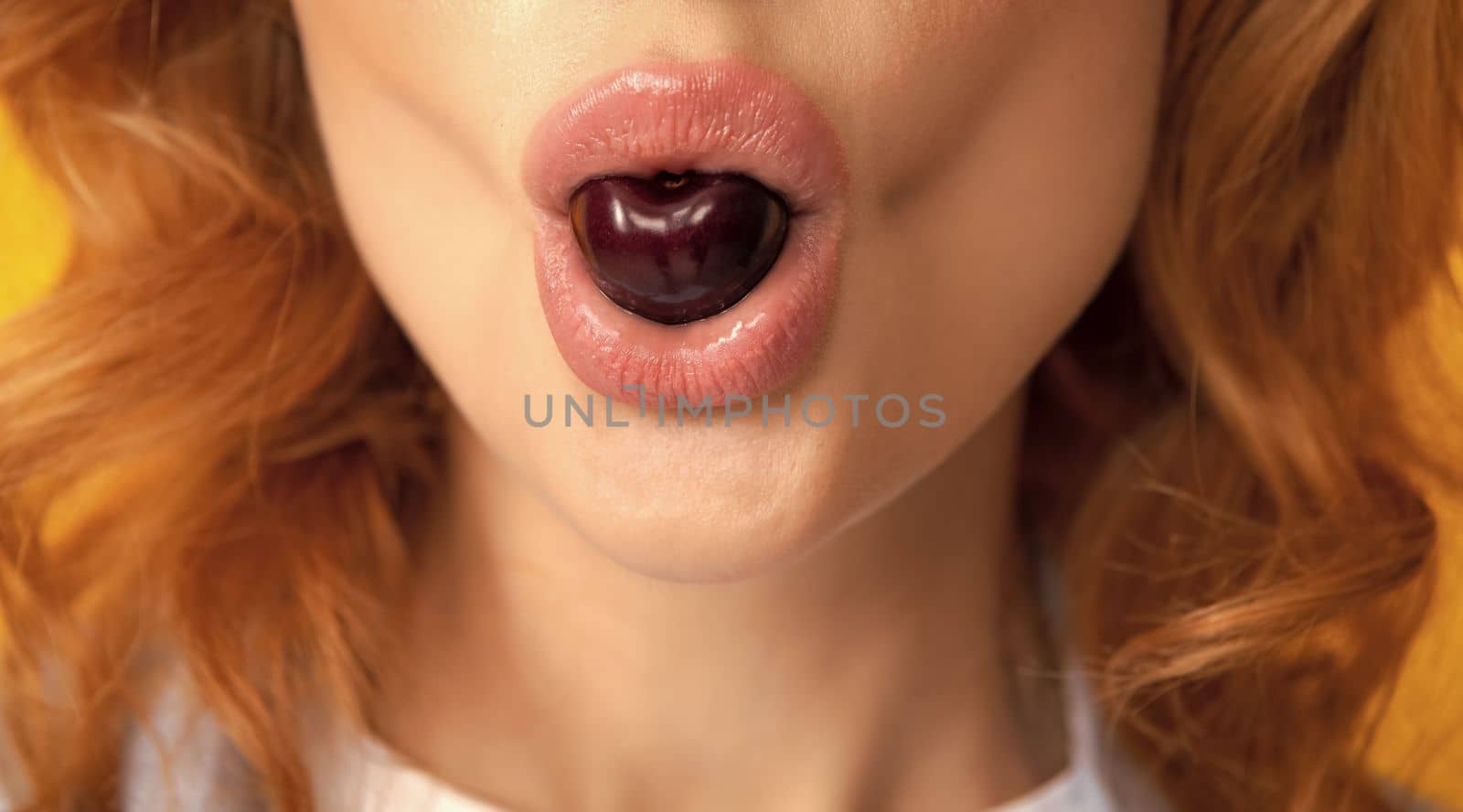 Womans enjoying fresh sweet cherry. Female mouth eating sweet cherry. Closeup female mouth tasting sweet cherry. by RedFoxStudio