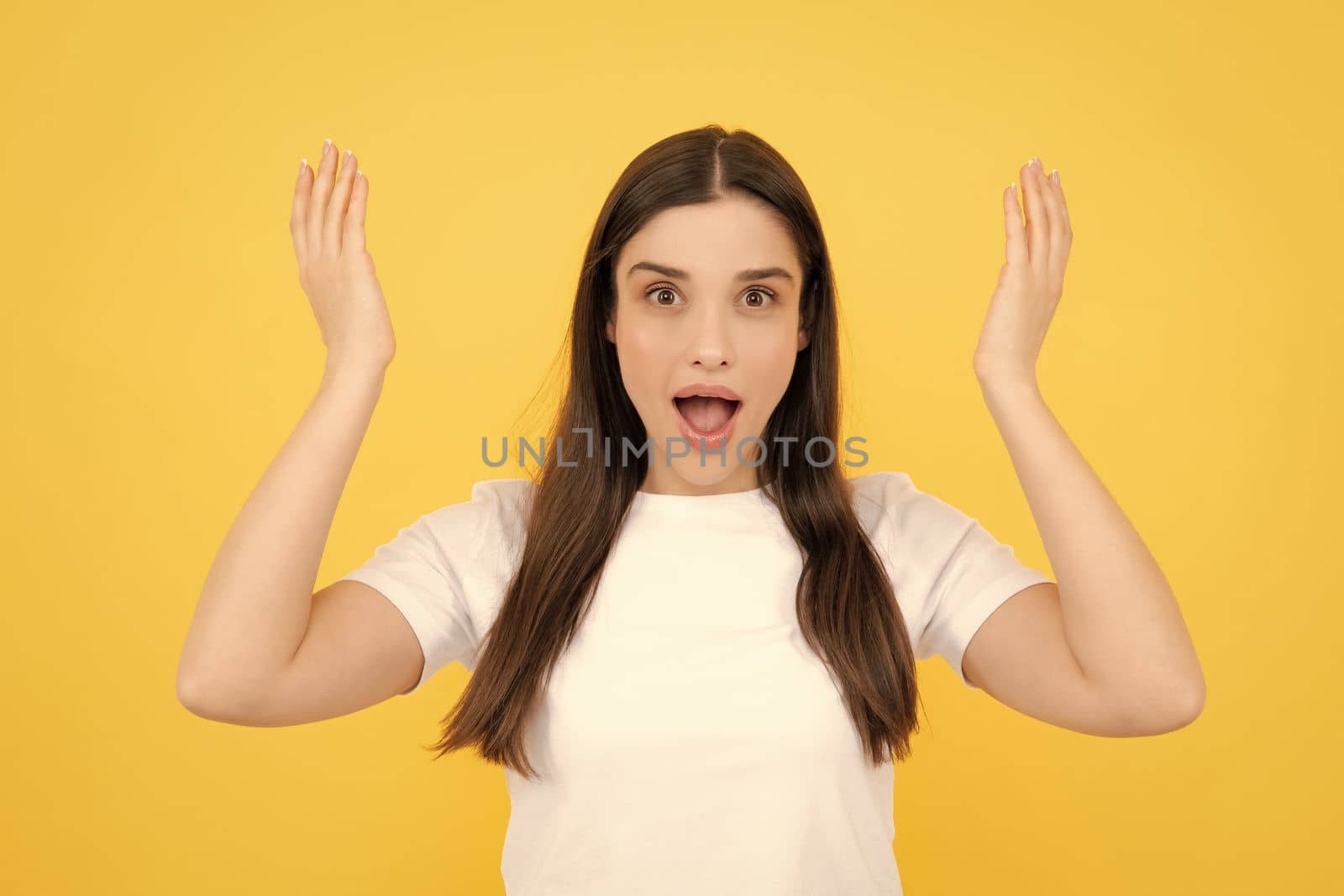 Surprised astonished young woman with open mouth. Portrait of excited amazed gasping girl. Expressive facial expressions. Excited female face. by RedFoxStudio