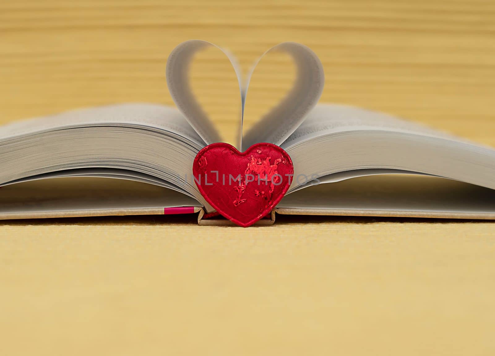 Valentine's Day concept. red, heart, background, open, book., from, folded, sheets., Close-up., soft, focus. by ketlit