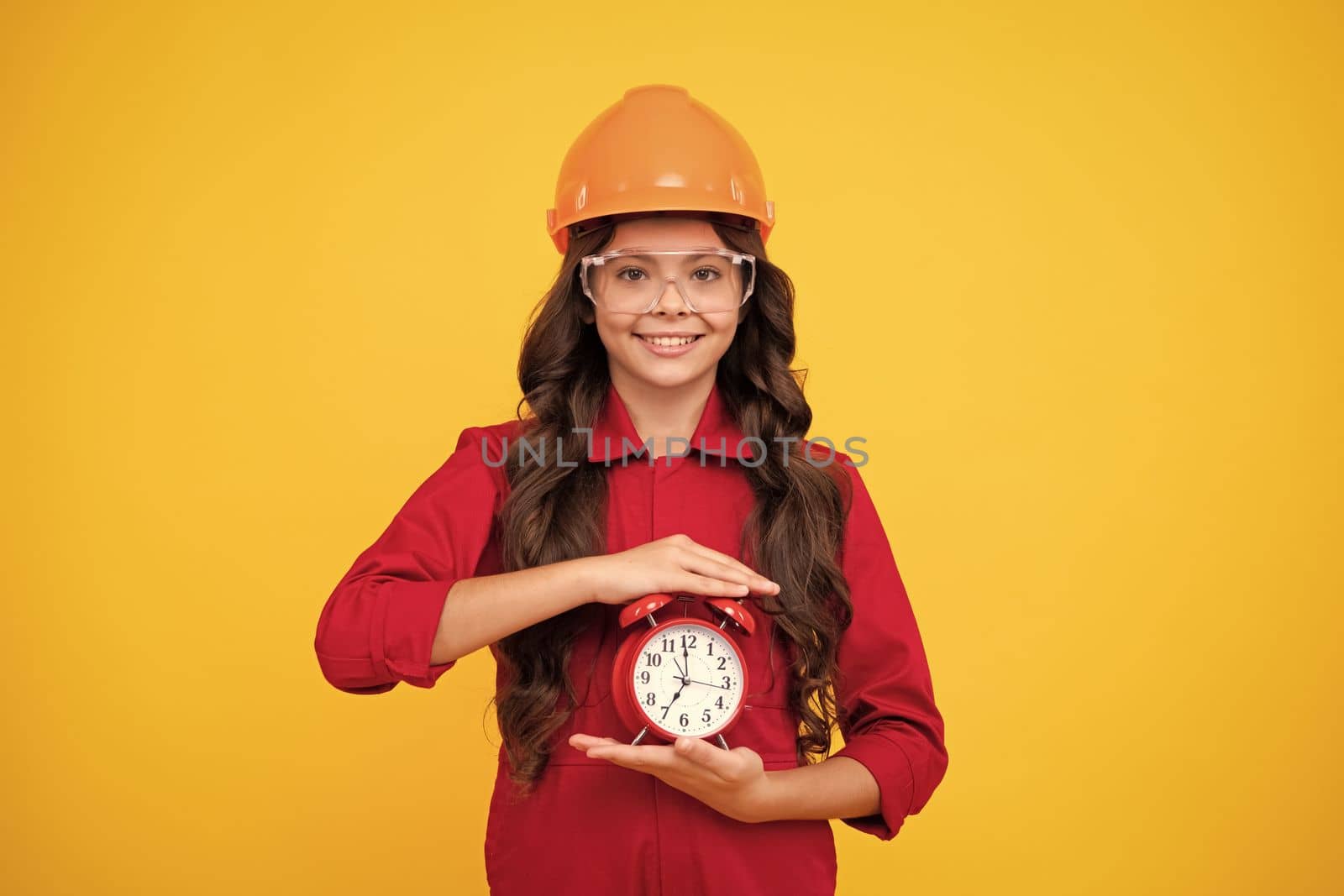 Time to renovation and repair. Child in hard hat. Kid builder painter on construction site. Excited teenager girl. Happy face, positive and smiling emotions of teenager girl