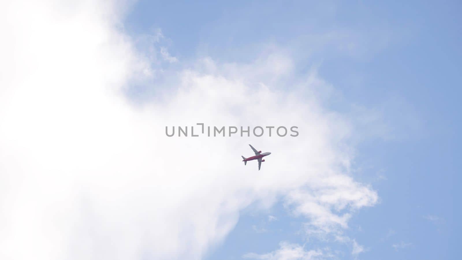 The plane is landing against the background of the evening blue sky