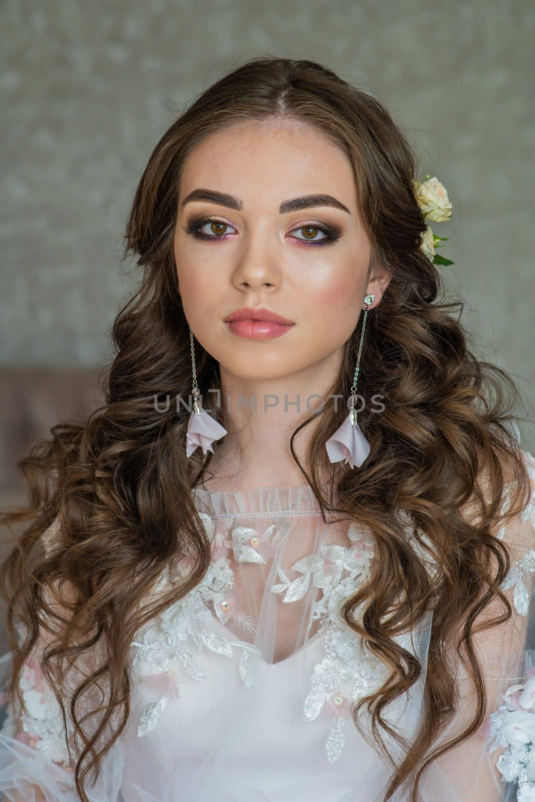 Beautiful festive make-up on a girl in a white dress. by DovidPro