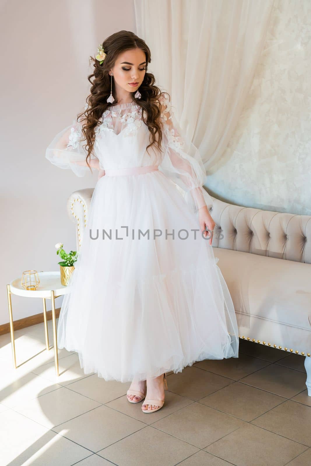 Girl model posing in a wedding dress