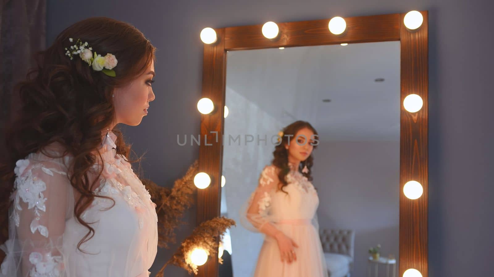 Girl model poses in a white dress
