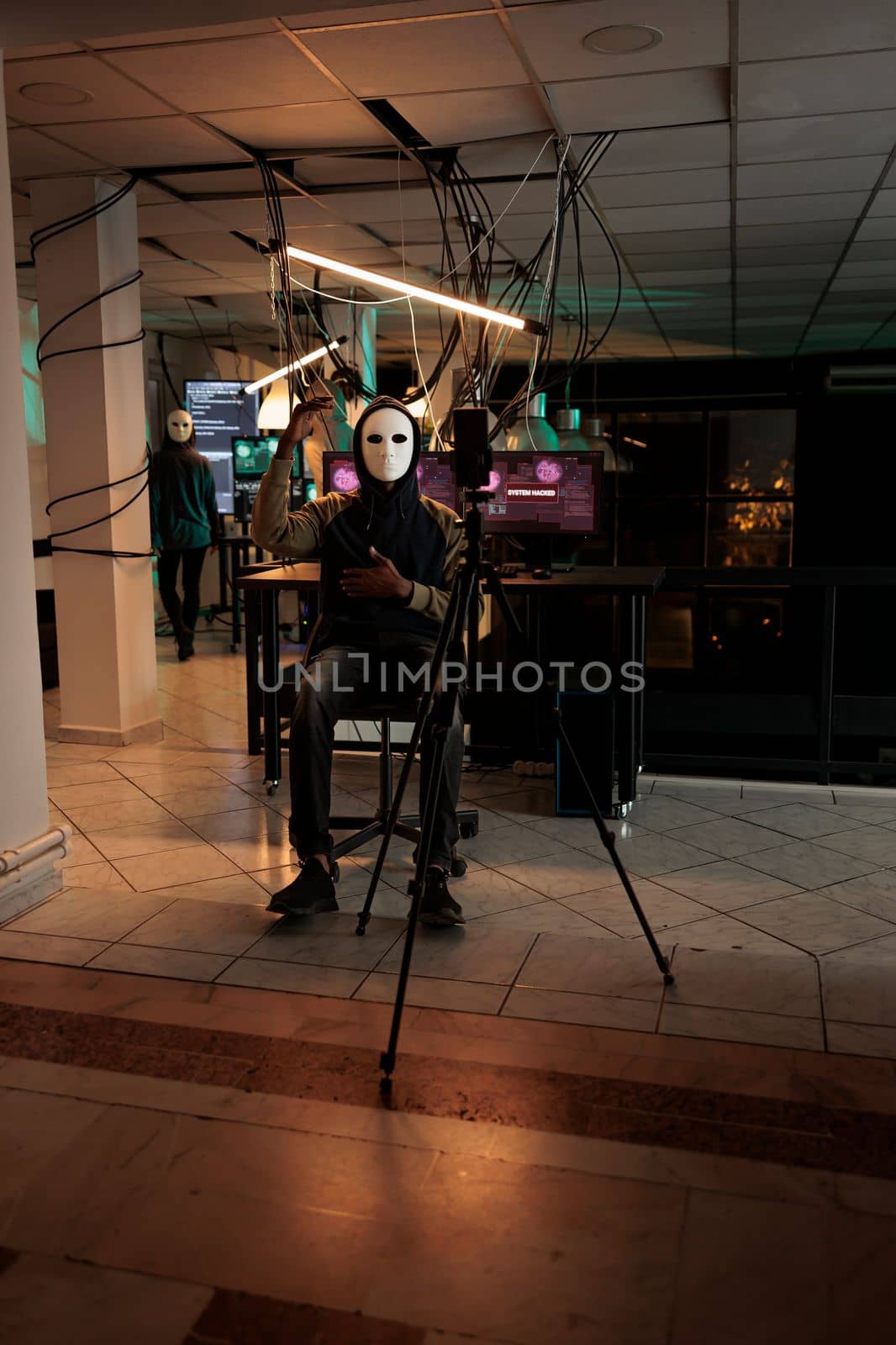 Young masked thief threatening on live broadcast video by DCStudio