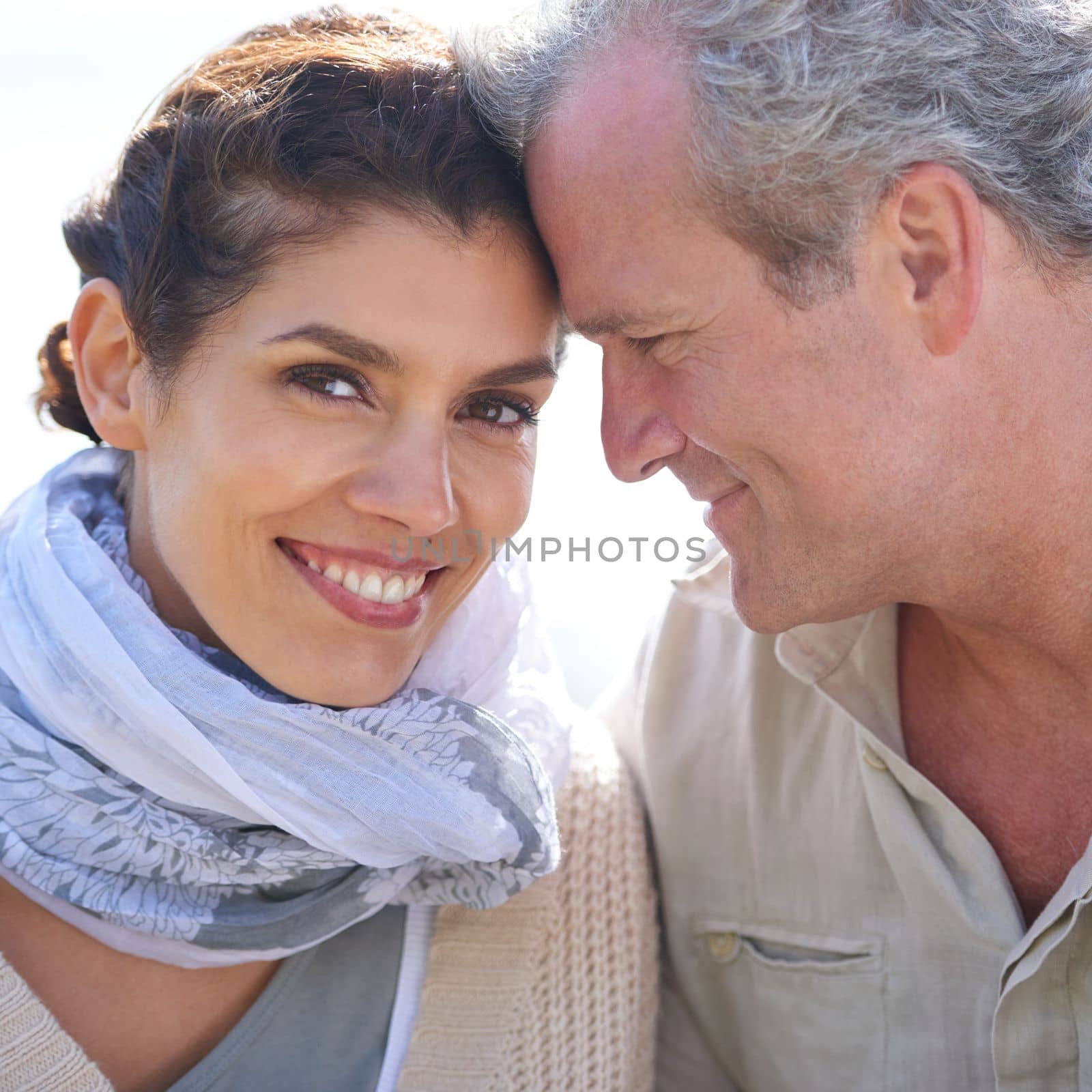 True love. A happy mature couple with their heads together affectionately