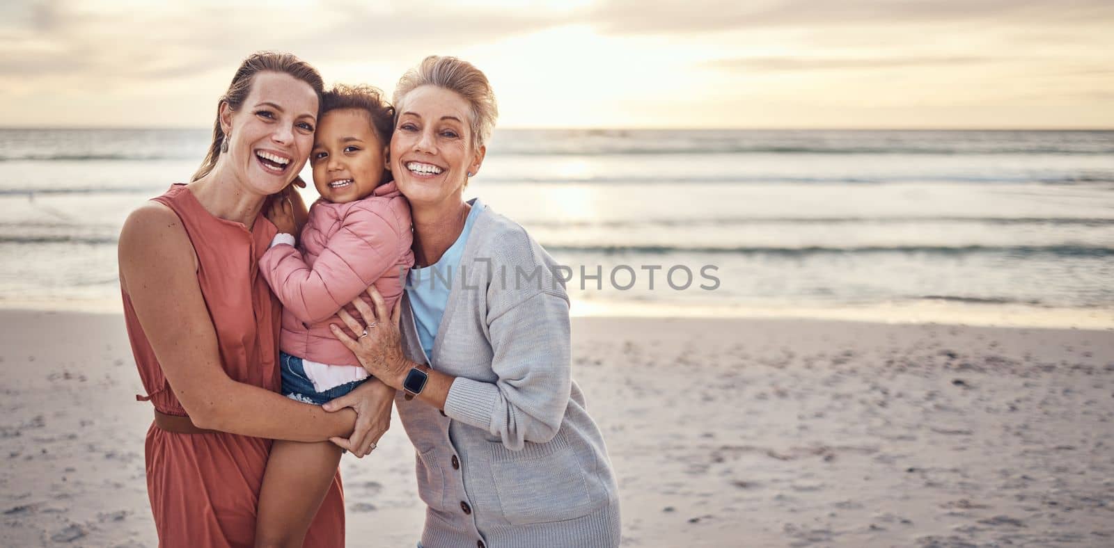 Lesbian, couple and portrait of family on beach together for travel vacation, happy and relax bonding by sea side. Happy homosexual parents, child smile and ocean sunset or relaxing in summer.