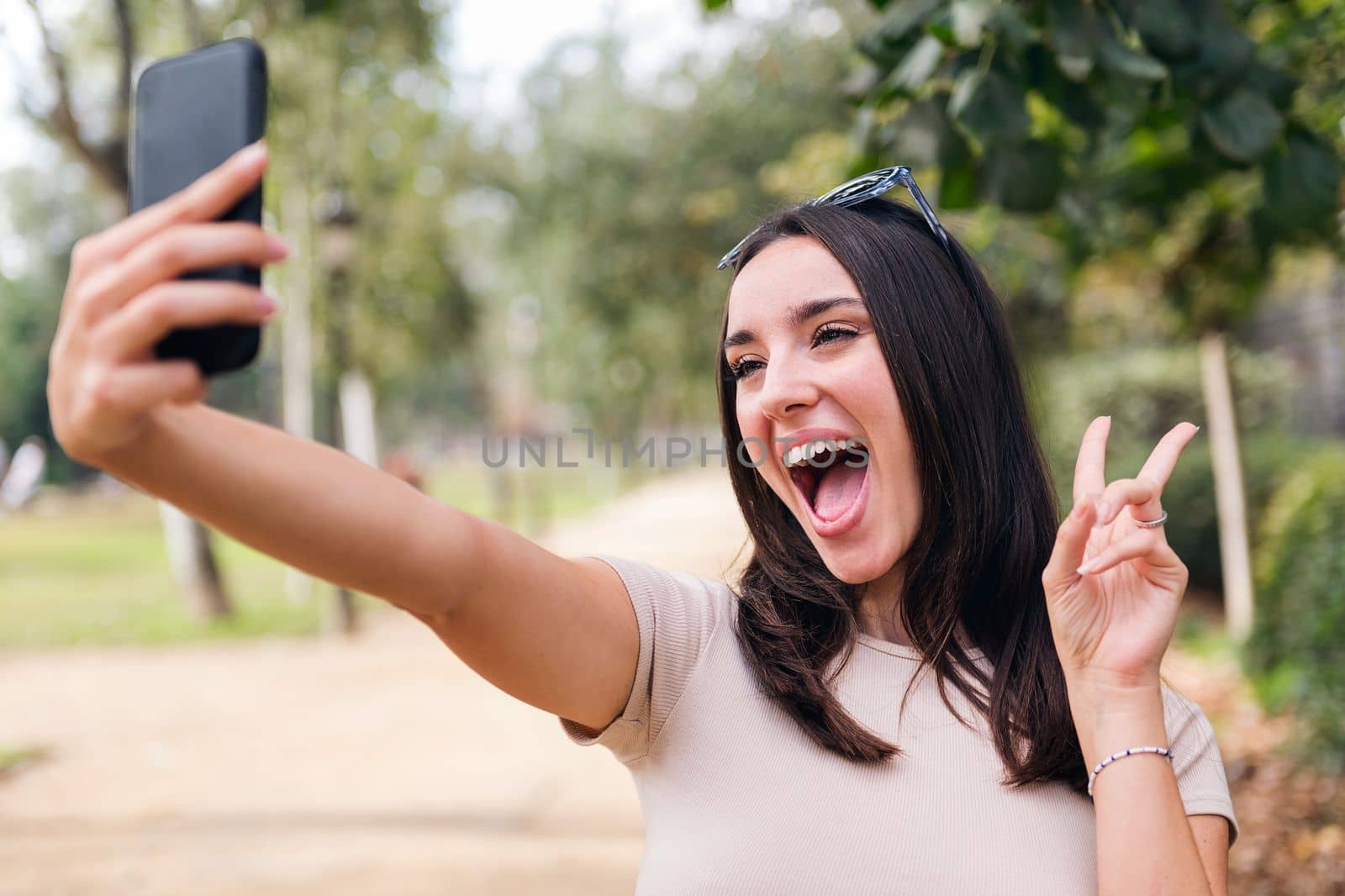 woman recording video for social media with phone by raulmelldo
