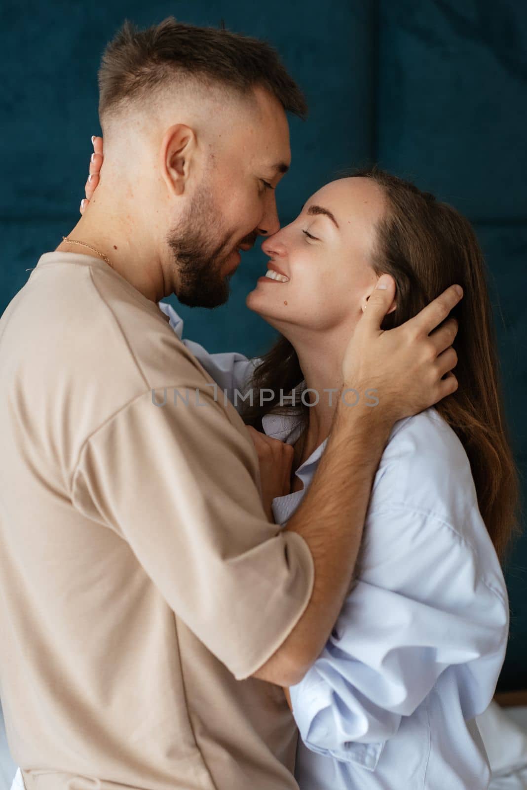 earlier morning bride and groom at home in bed