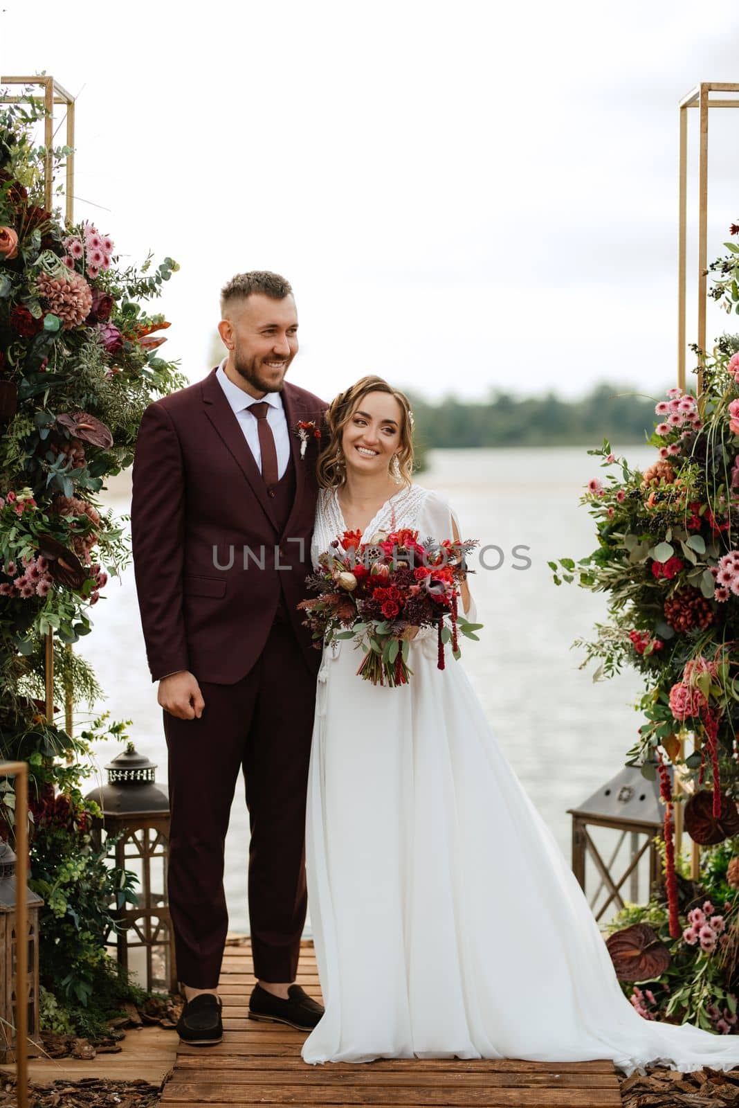 wedding ceremony of the newlyweds on the pier by Andreua