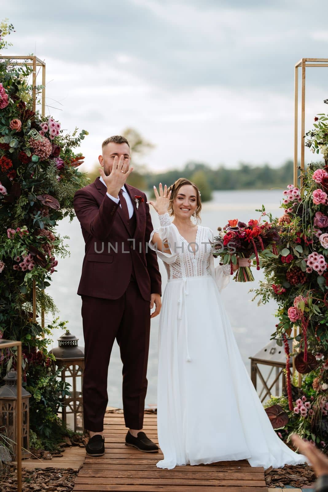 wedding ceremony of the newlyweds on the pier by Andreua