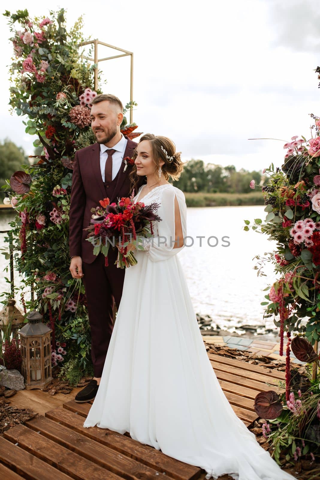 wedding ceremony of the newlyweds on the pier by Andreua