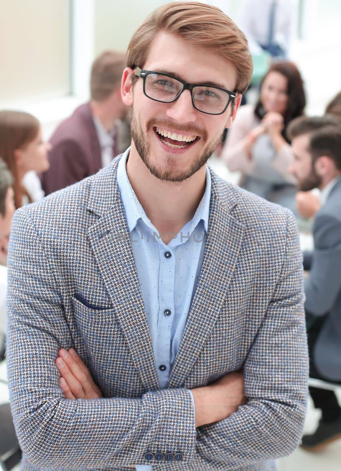 close up. smiling business man on the background of the office . business people